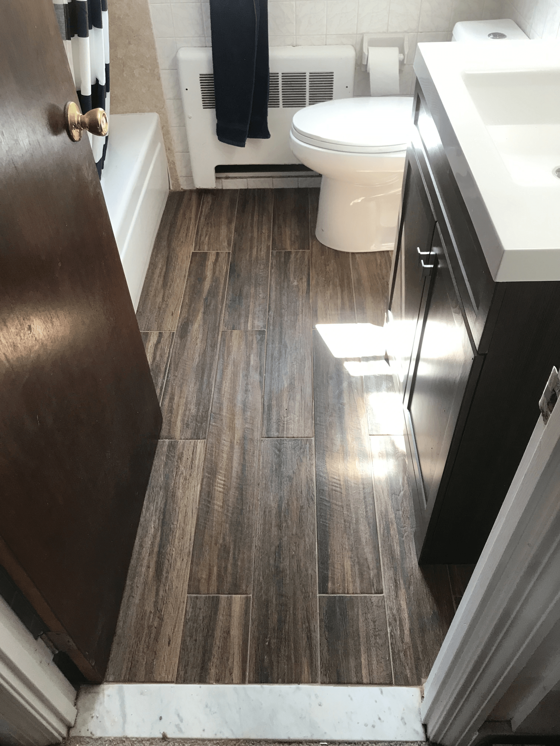 Bathroom remodel with wood-look tile floor