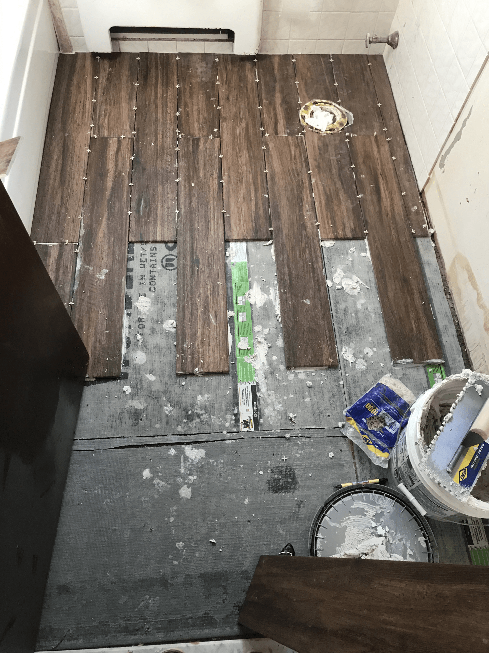 Hexagonal floor tile being set with spacers